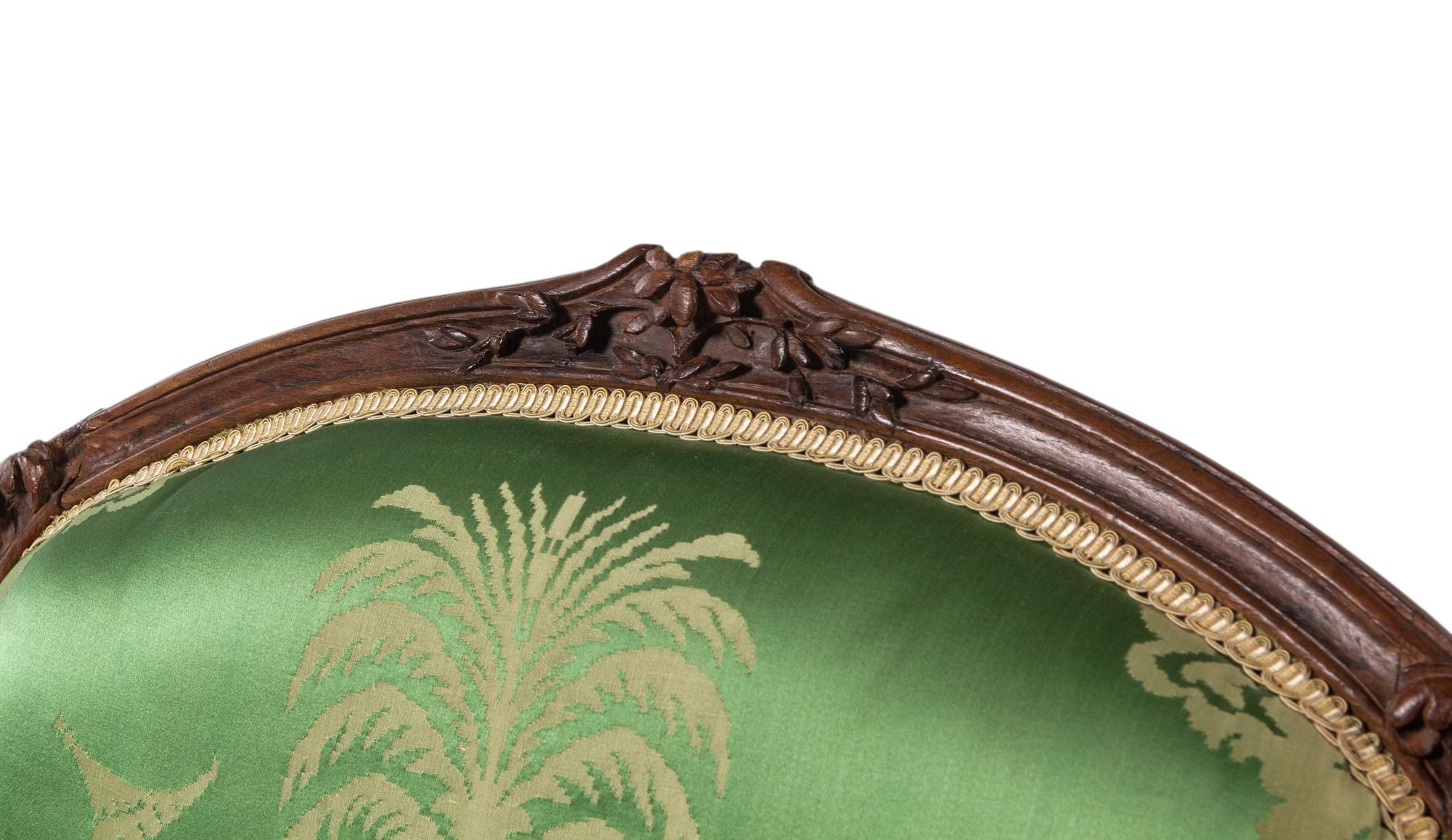 A Pair of Louis XV Beechwood Fauteuils