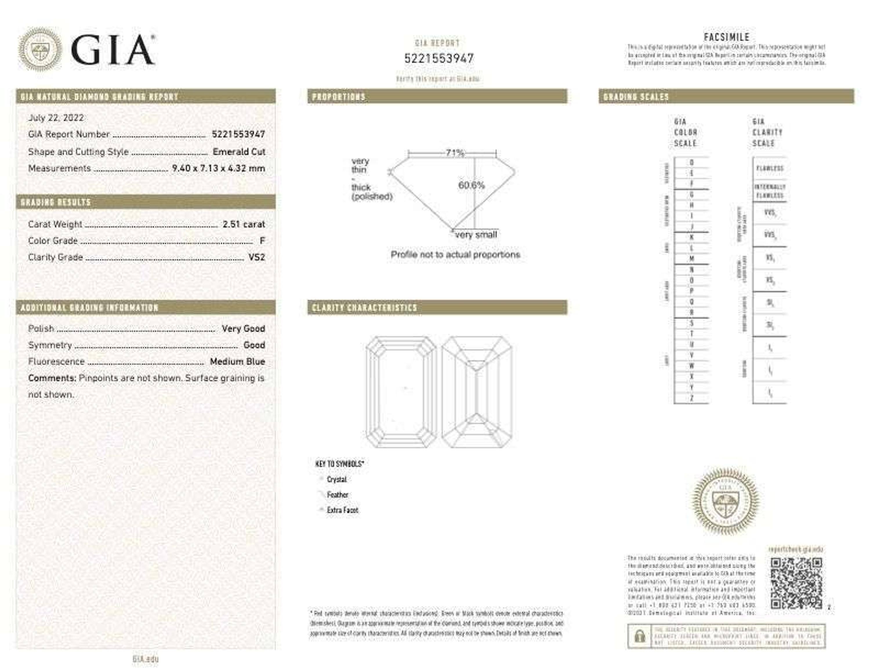 An emerald-cut diamond accented solitaire ring