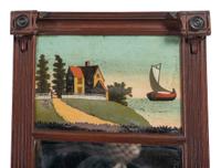 A Classical Carved Mahogany and Reverse Painted Panel Inset Looking Glass