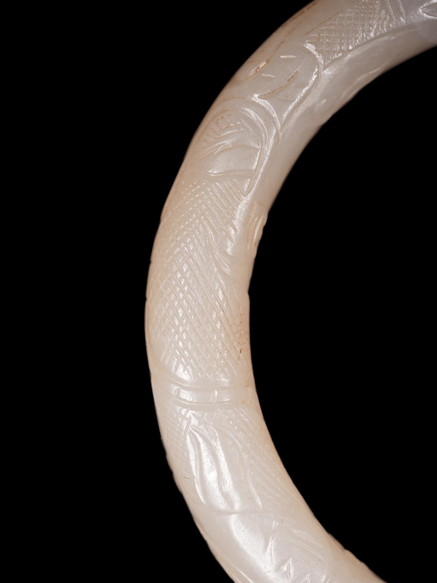 Four Chinese Celadon Archer's Rings and Two White Jade Bangles