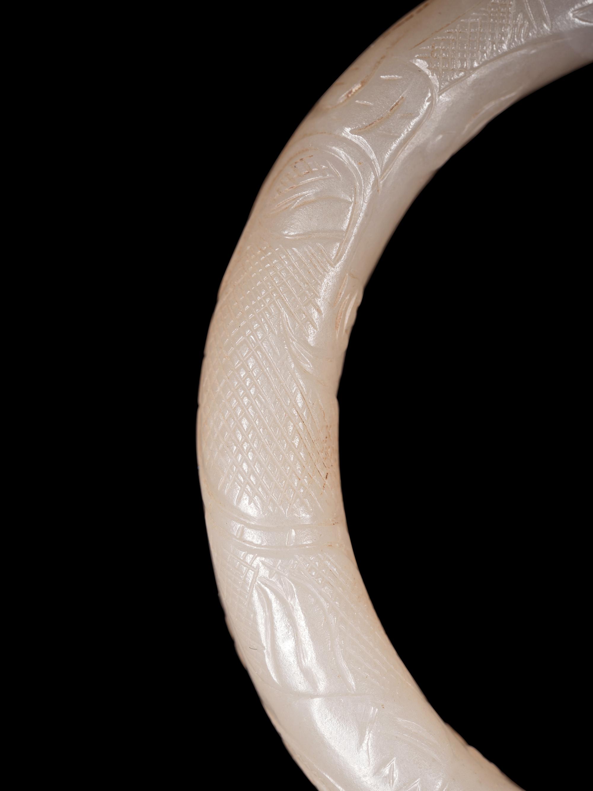 Four Chinese Celadon Archer's Rings and Two White Jade Bangles