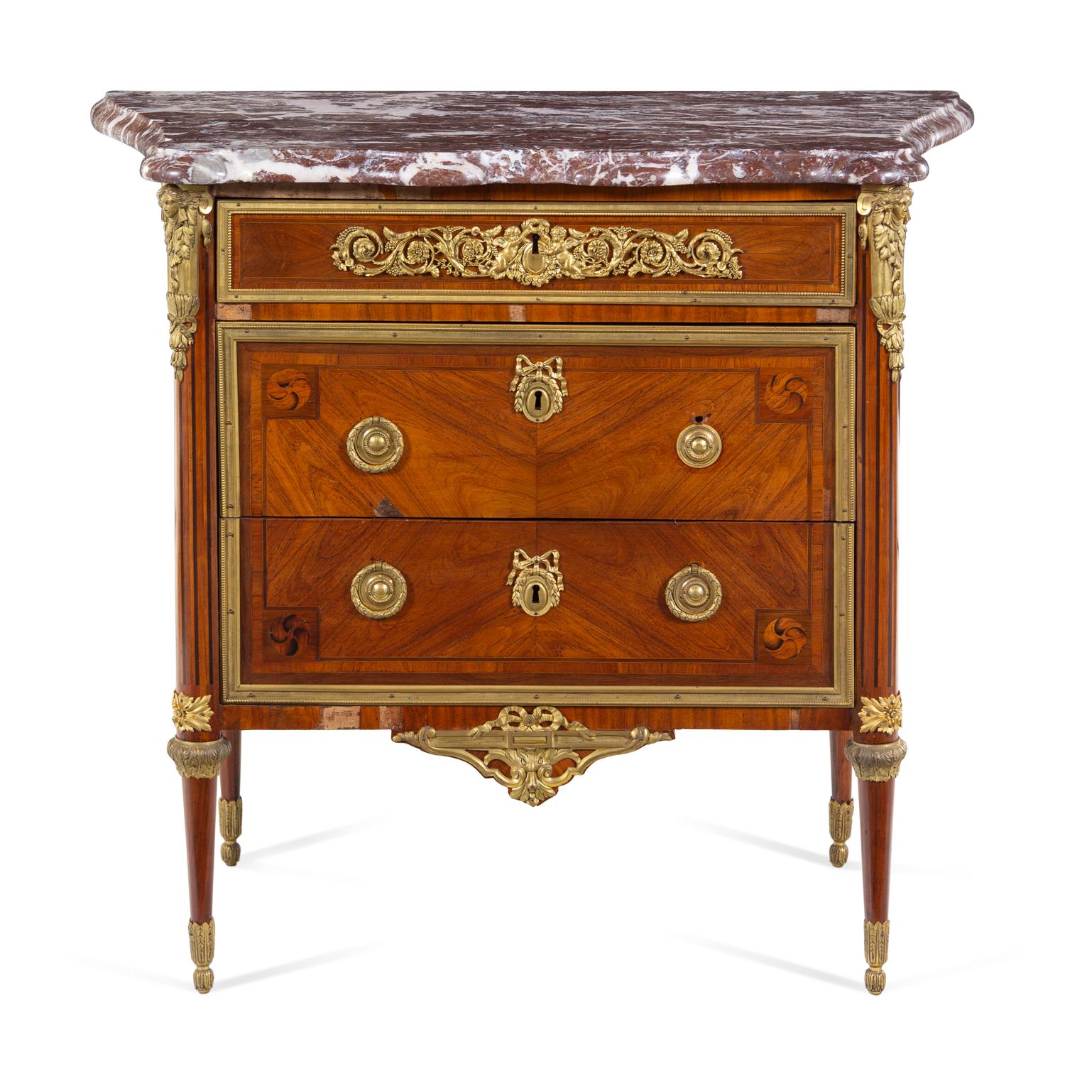A Louis XVI Gilt Bronze Mounted Tulipwood Commode with an Unassociated Marble Top