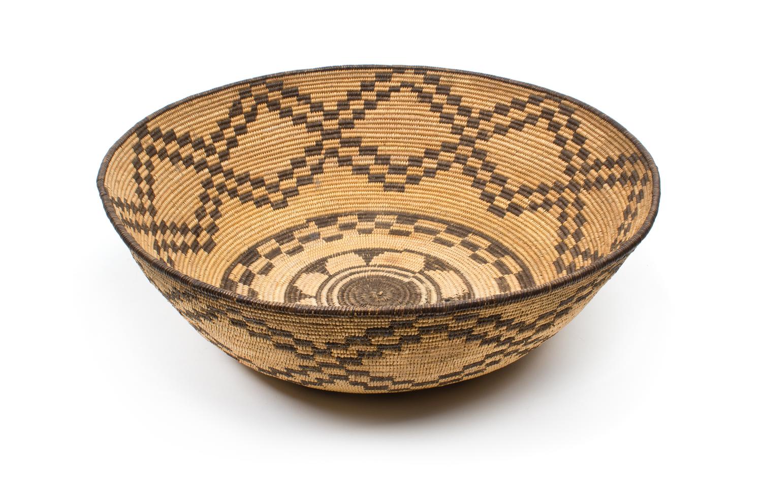 An Apache Basketry Bowl Height 4 3/4 x 14 1/2 inches.