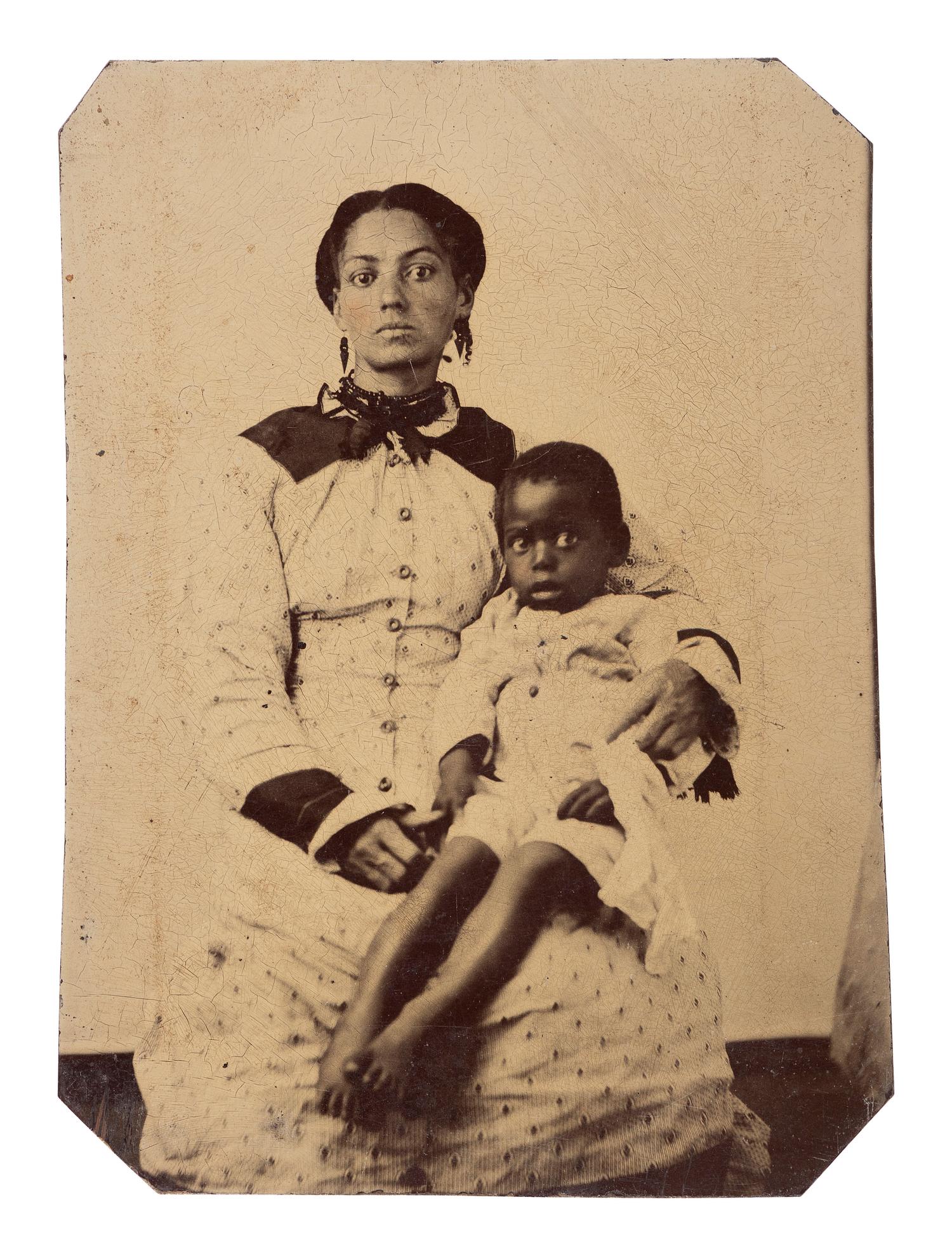 [AFRICAN AMERICANA - EARLY PHOTOGRAPHY]. Tintype of African American woman and child.