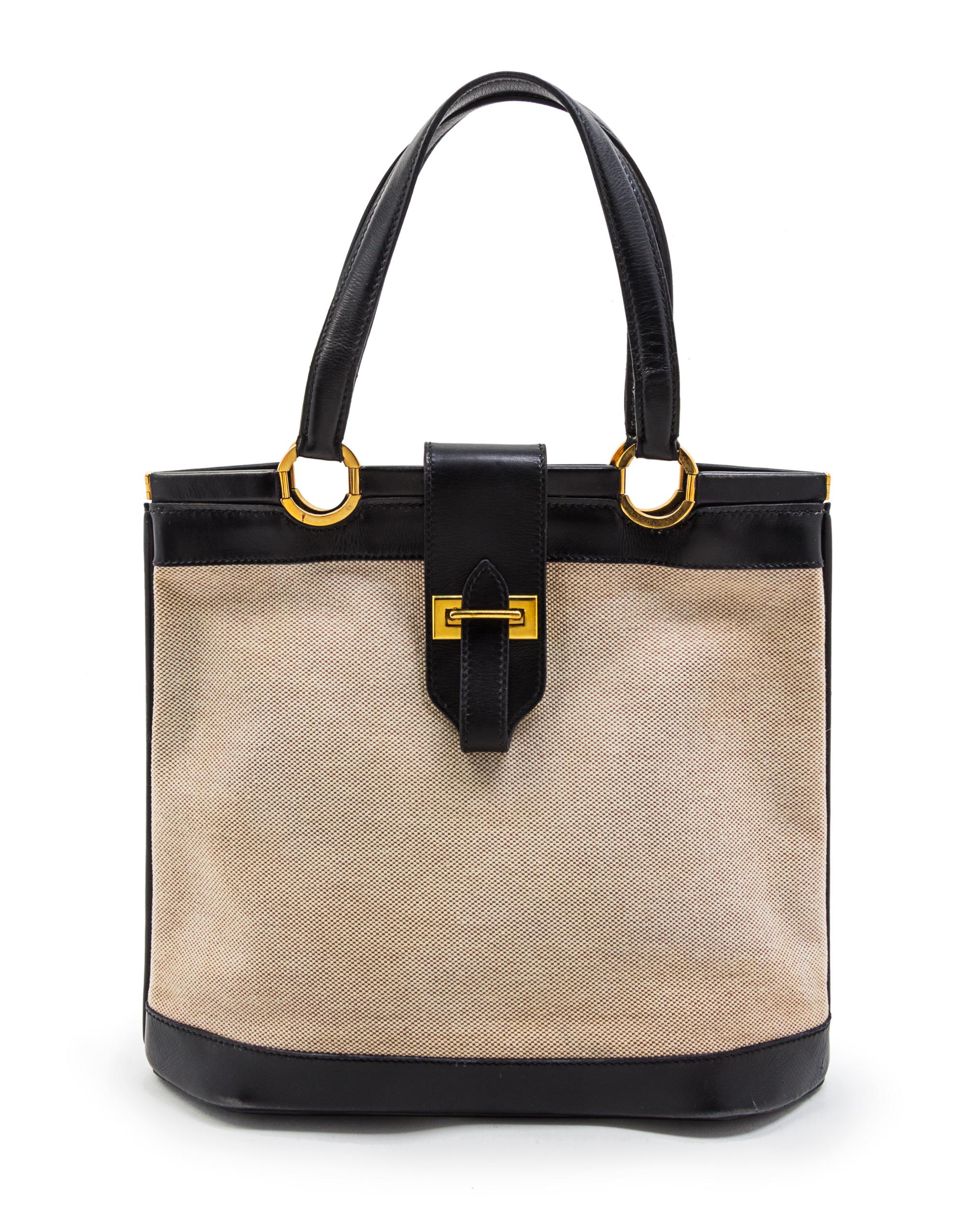 An Hermes Black Leather and Ivory Canvas Bag, 12 x 10 1/2 x 4 1/2 inches.