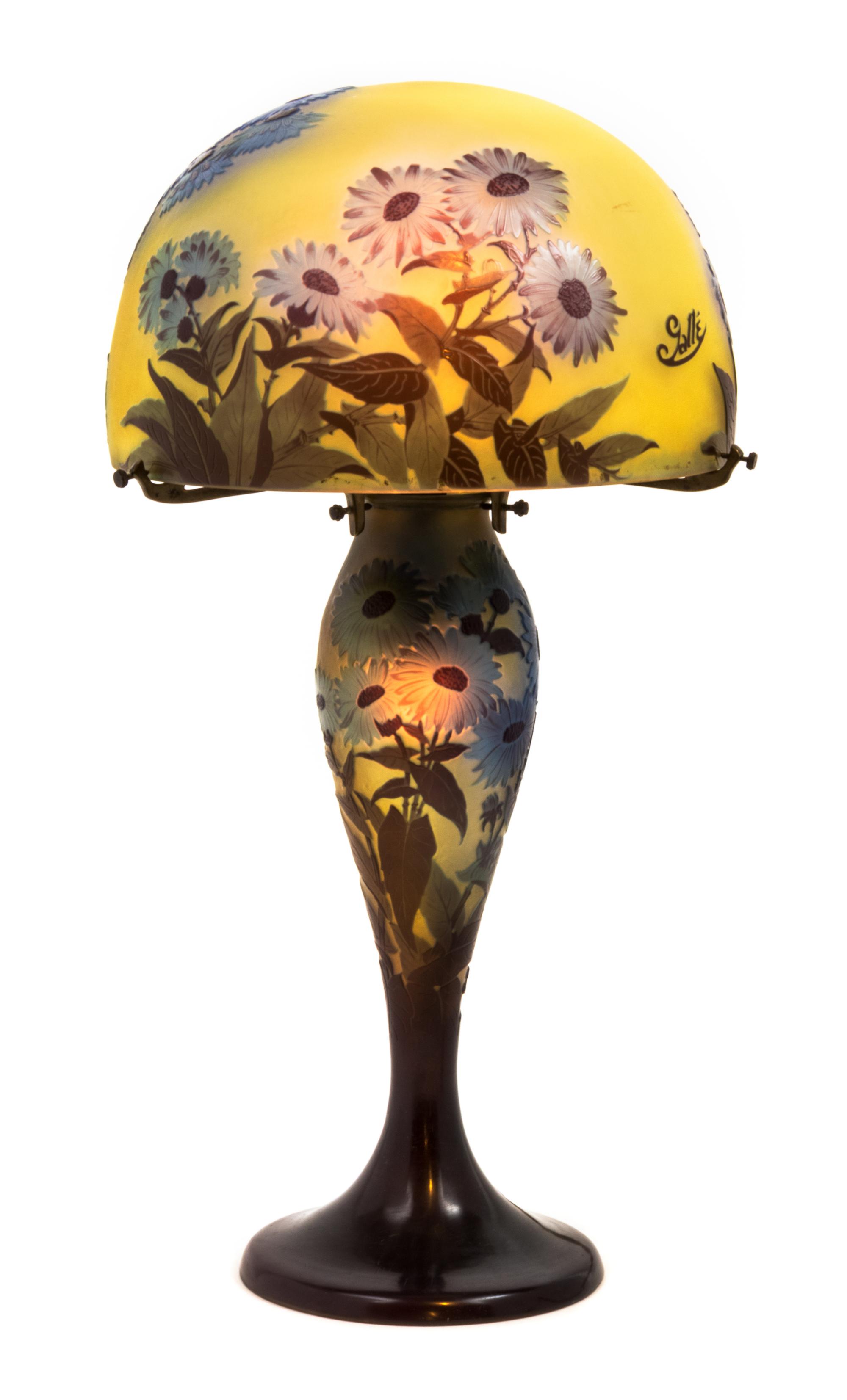 Emile Galle, (French, 1846-1904), a cameo glass lamp, the domed shade and baluster form base decorated with blue flowers
