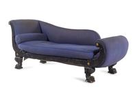 An Empire Style Gilt Metal Mounted Ebonized Chaise Longue