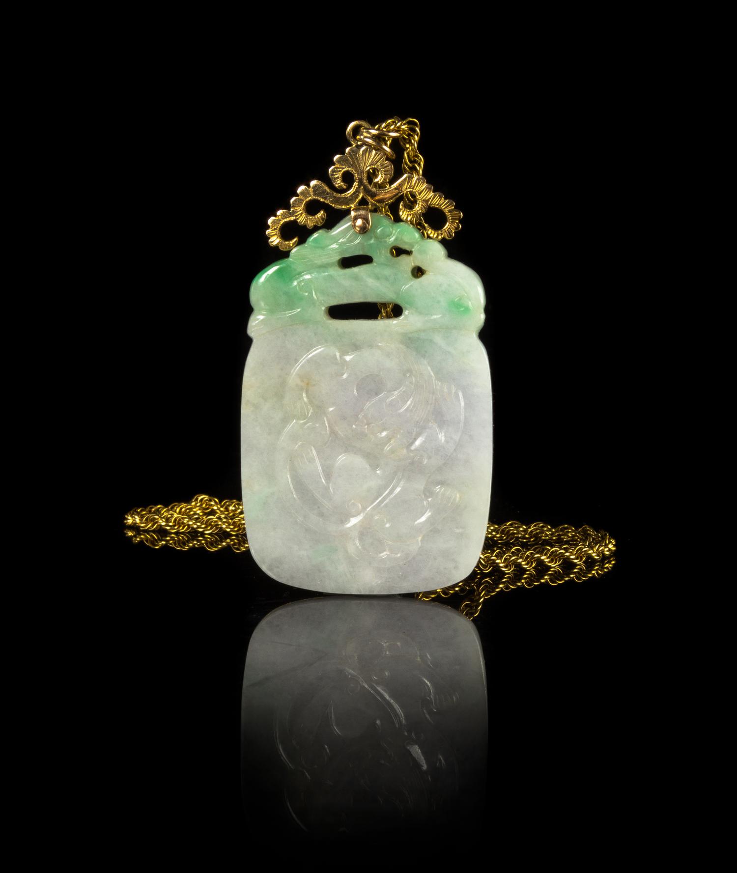 A Carved Apple Green and Celadon Jadeite Plaque — REPUBLIC PERIOD