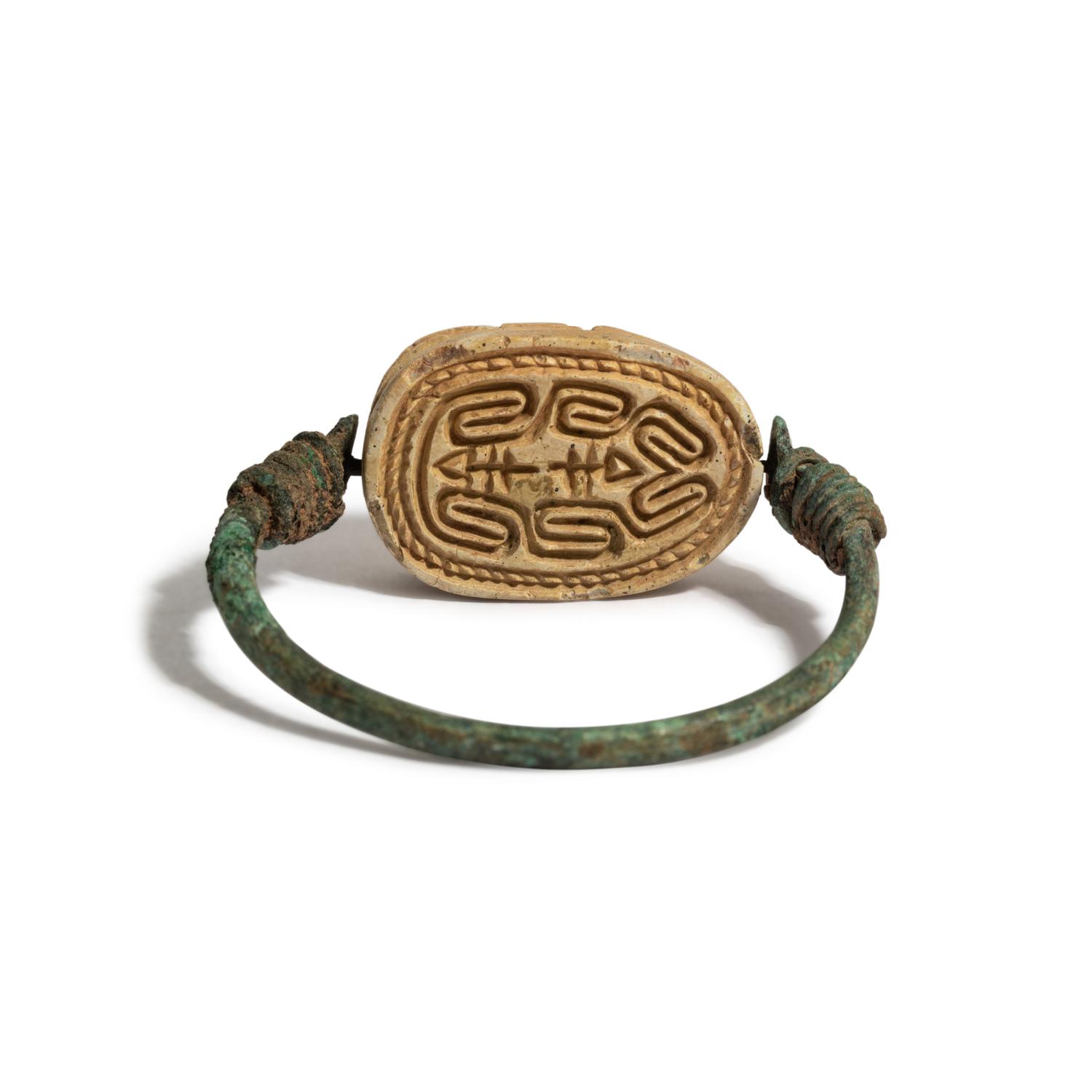 An Egyptian Bronze and 'Hyksos' Scarab Swivel Ring