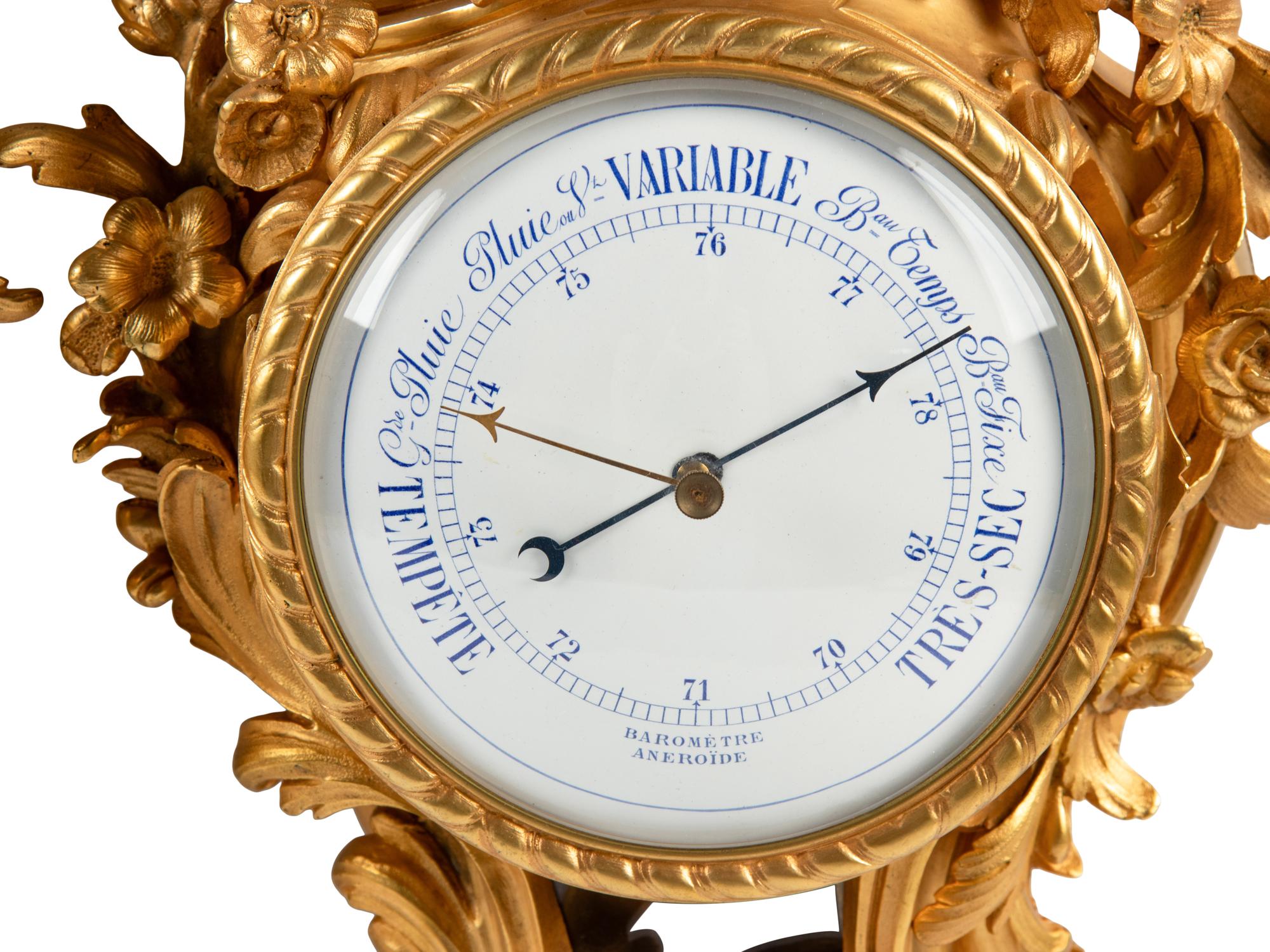 A Louis XV Style Gilt Bronze Cartel Clock and Barometer