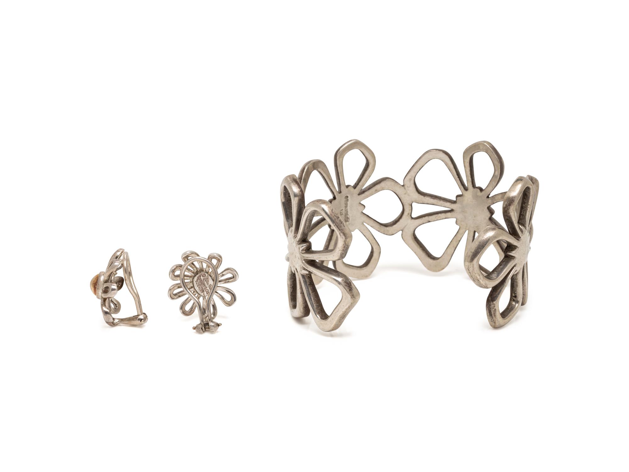 TIFFANY & CO., COLLECTION OF STERLING SILVER AND YELLOW GOLD FLORAL JEWELRY