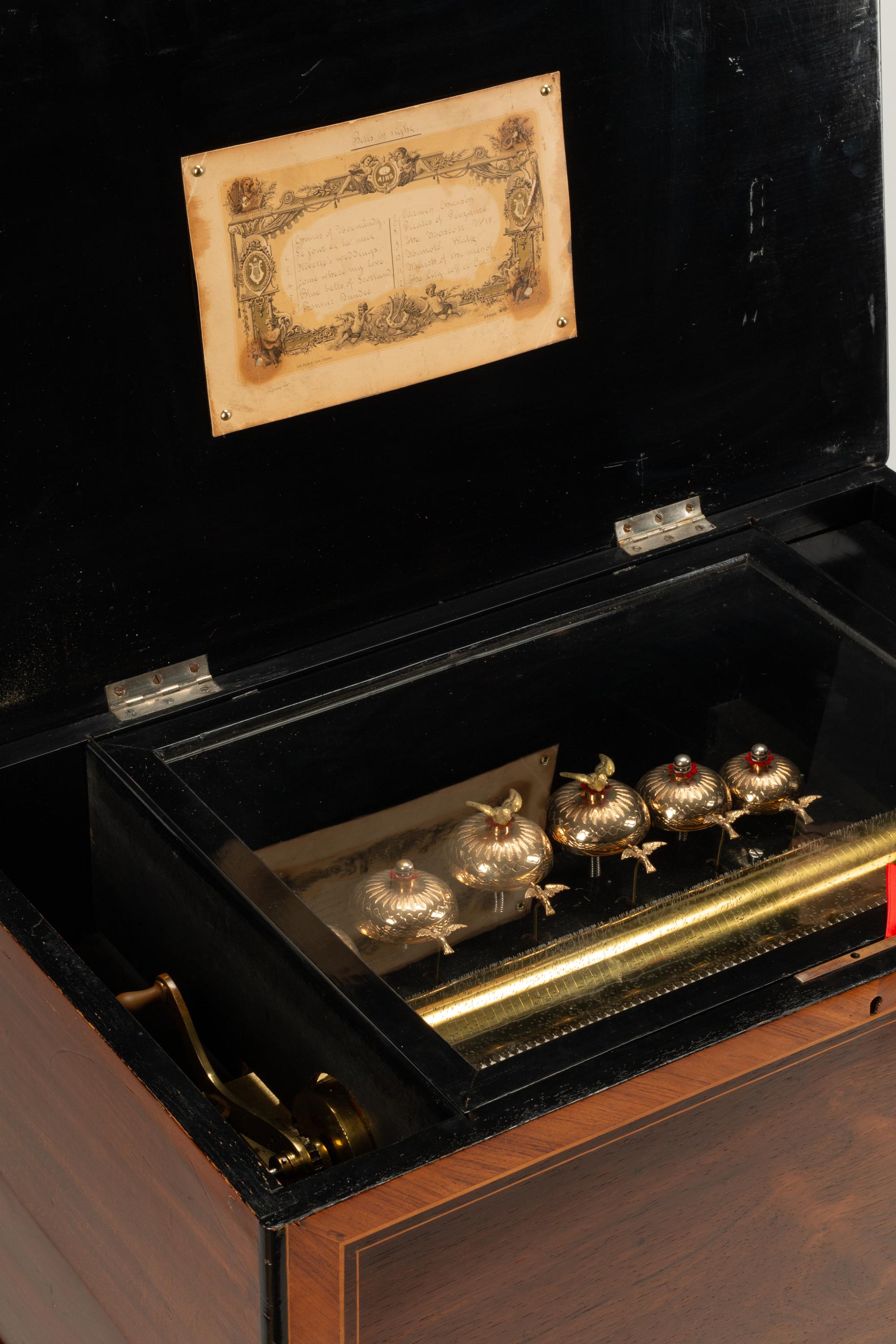 A Swiss Marquetry ‘Bells in Sight’ Cylinder Music Box on Stand