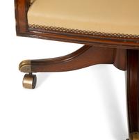 A Regency Style Mahogany Barrell Back Swivel Desk Chair
