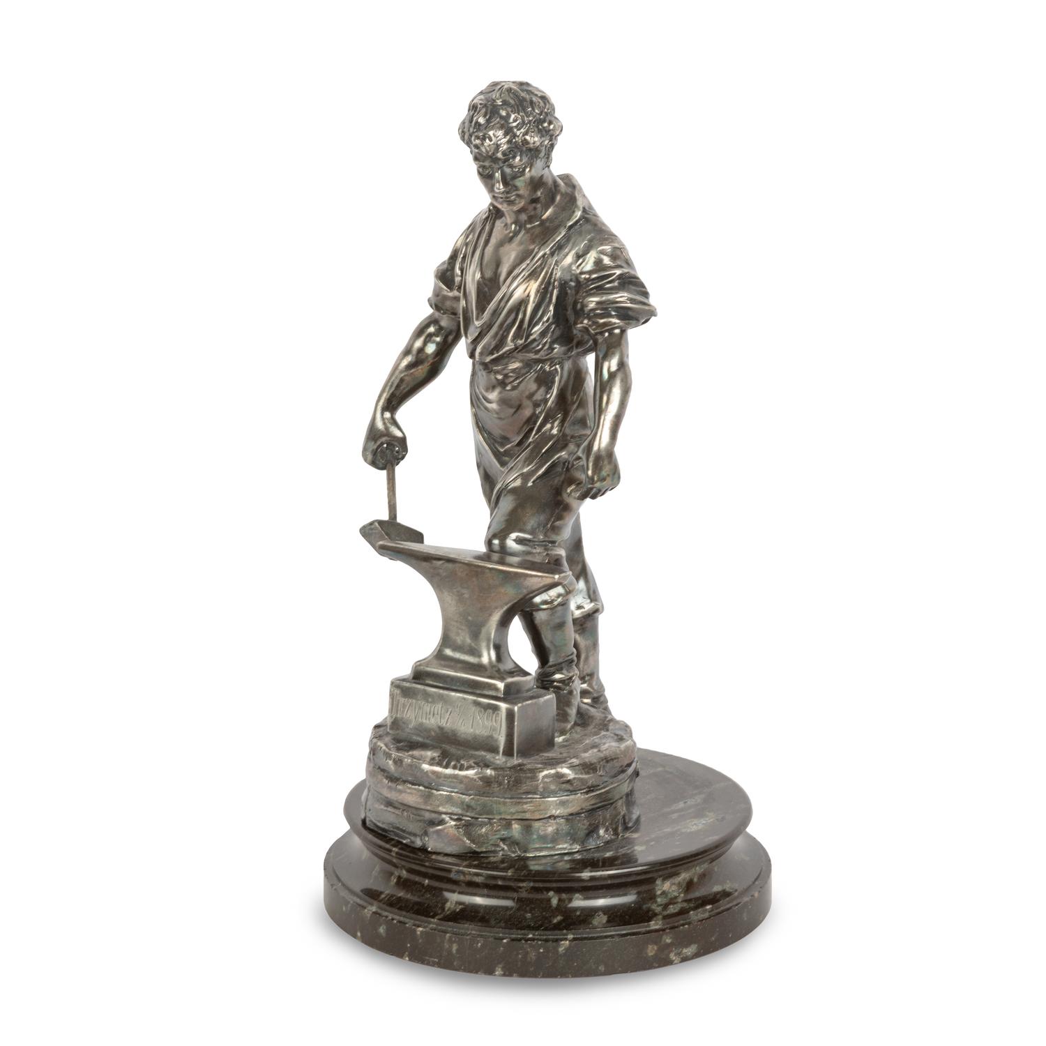 A Czech Silvered Metal Figure of a Blacksmith