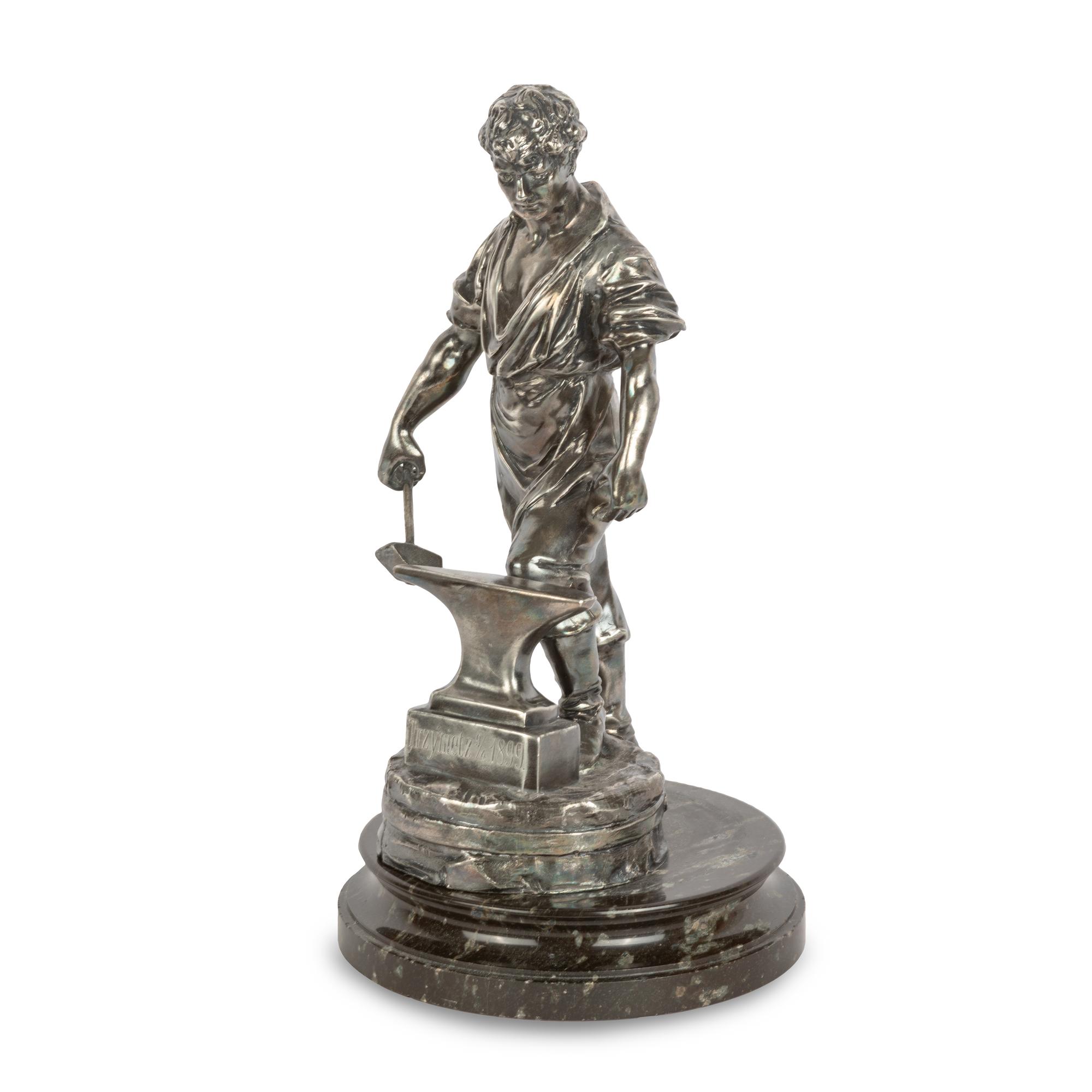 A Czech Silvered Metal Figure of a Blacksmith
