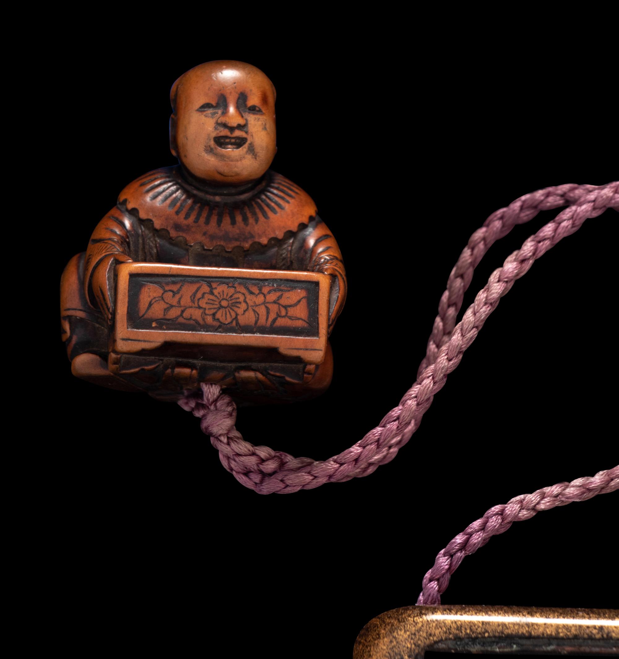 A Japanese Silver and Gold Lacquered Tobacco Box, Tonkotsu, and Netsuke