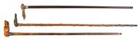 Three Carved Animalier Canes, Height of tallest overall 36 1/4 inches.