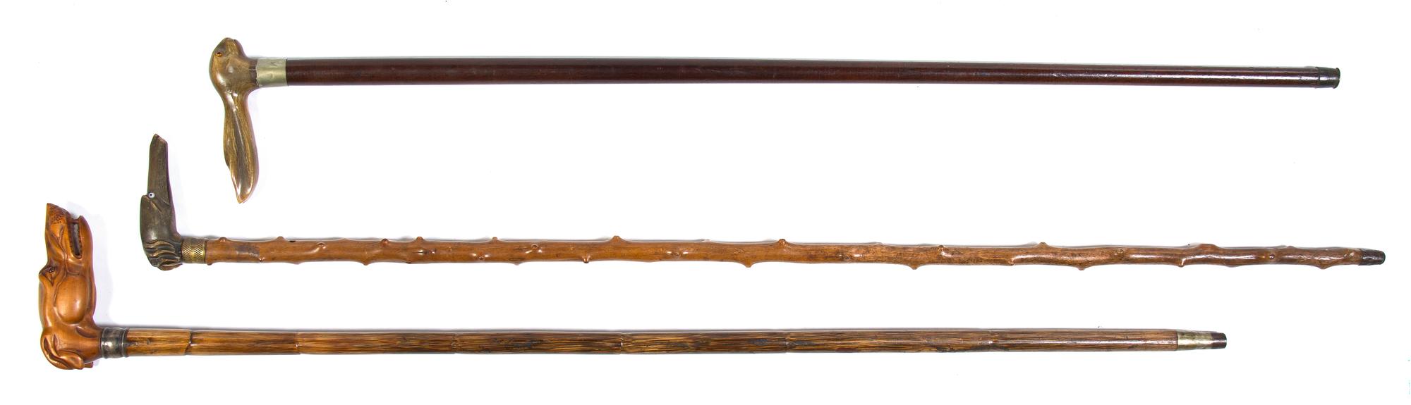 Three Carved Animalier Canes, Height of tallest overall 36 1/4 inches.