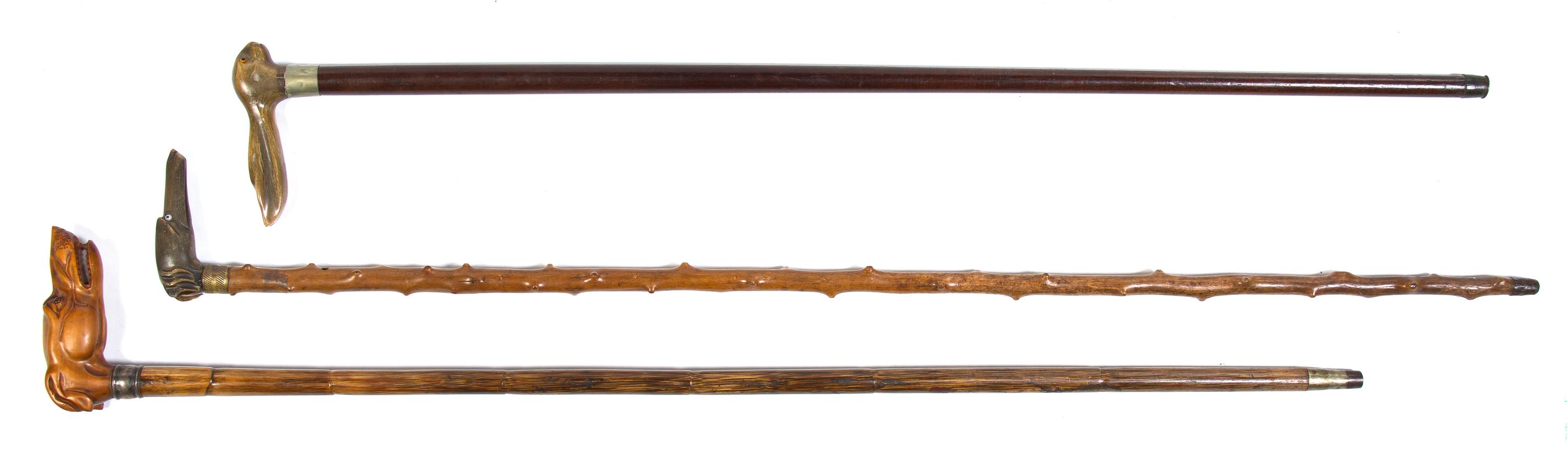 Three Carved Animalier Canes, Height of tallest overall 36 1/4 inches.