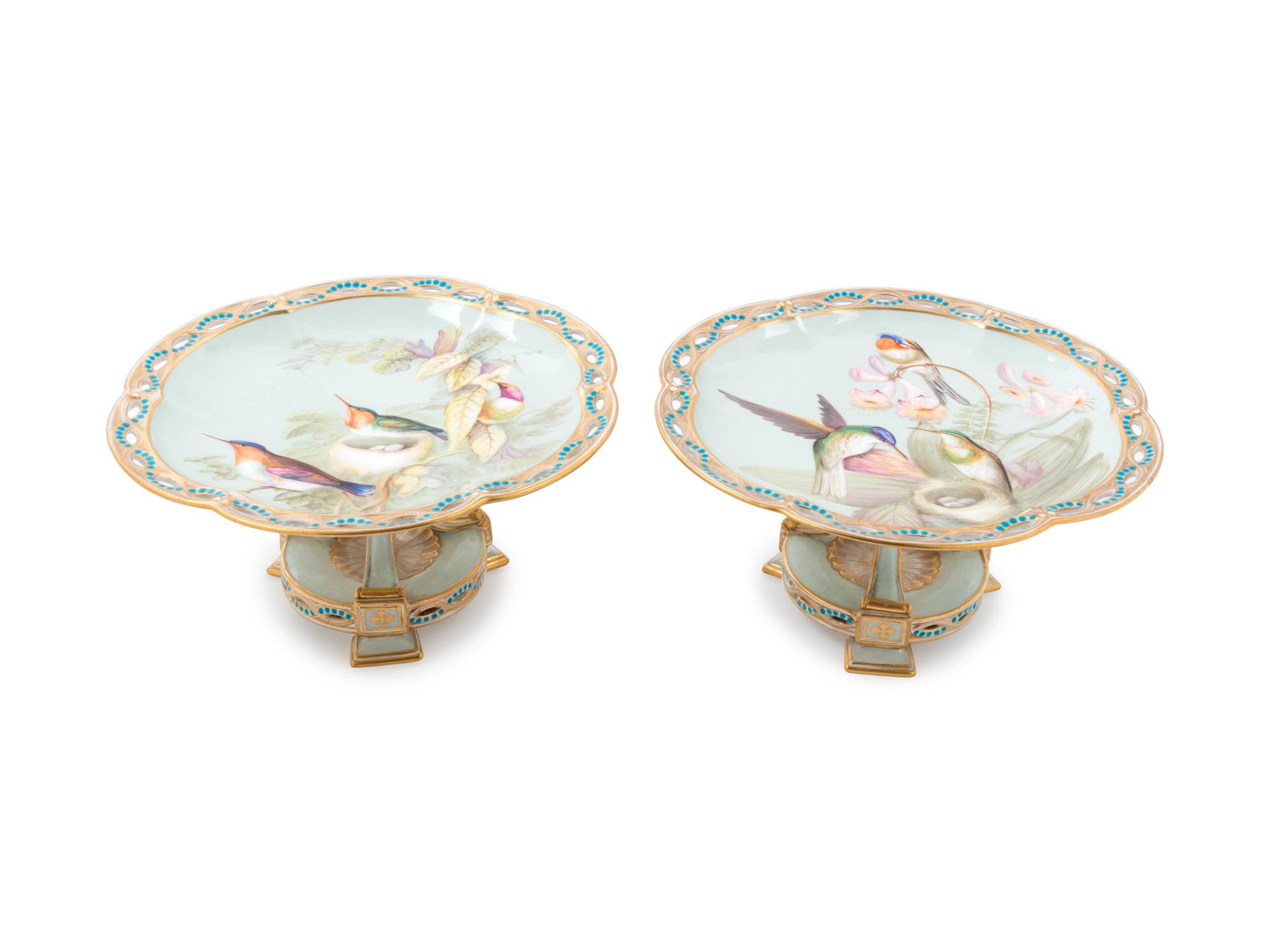 A Pair of Continental Ornithological Painted and Parcel Gilt Porcelain Compotes
