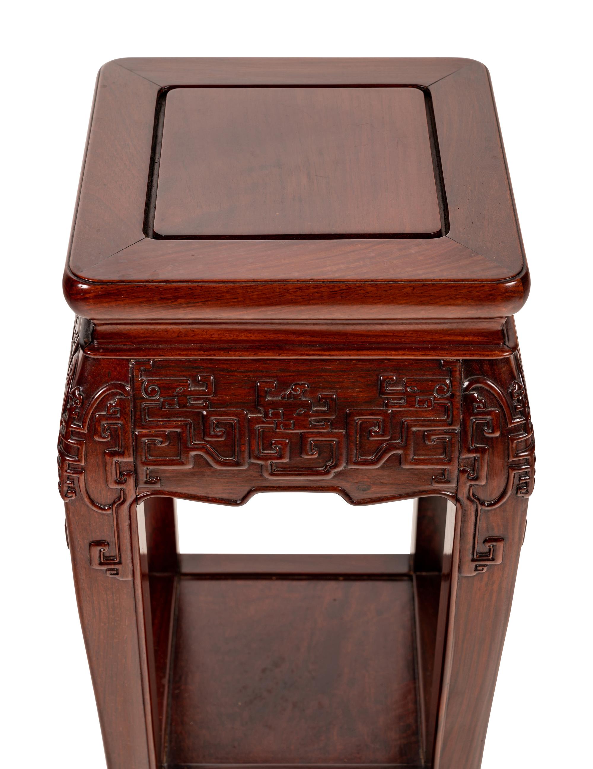 A Pair of Chinese Carved Hardwood Pedestals