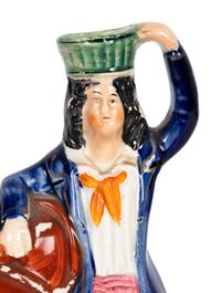 A Collection of Twelve Staffordshire Pottery Figures and Figural Wares