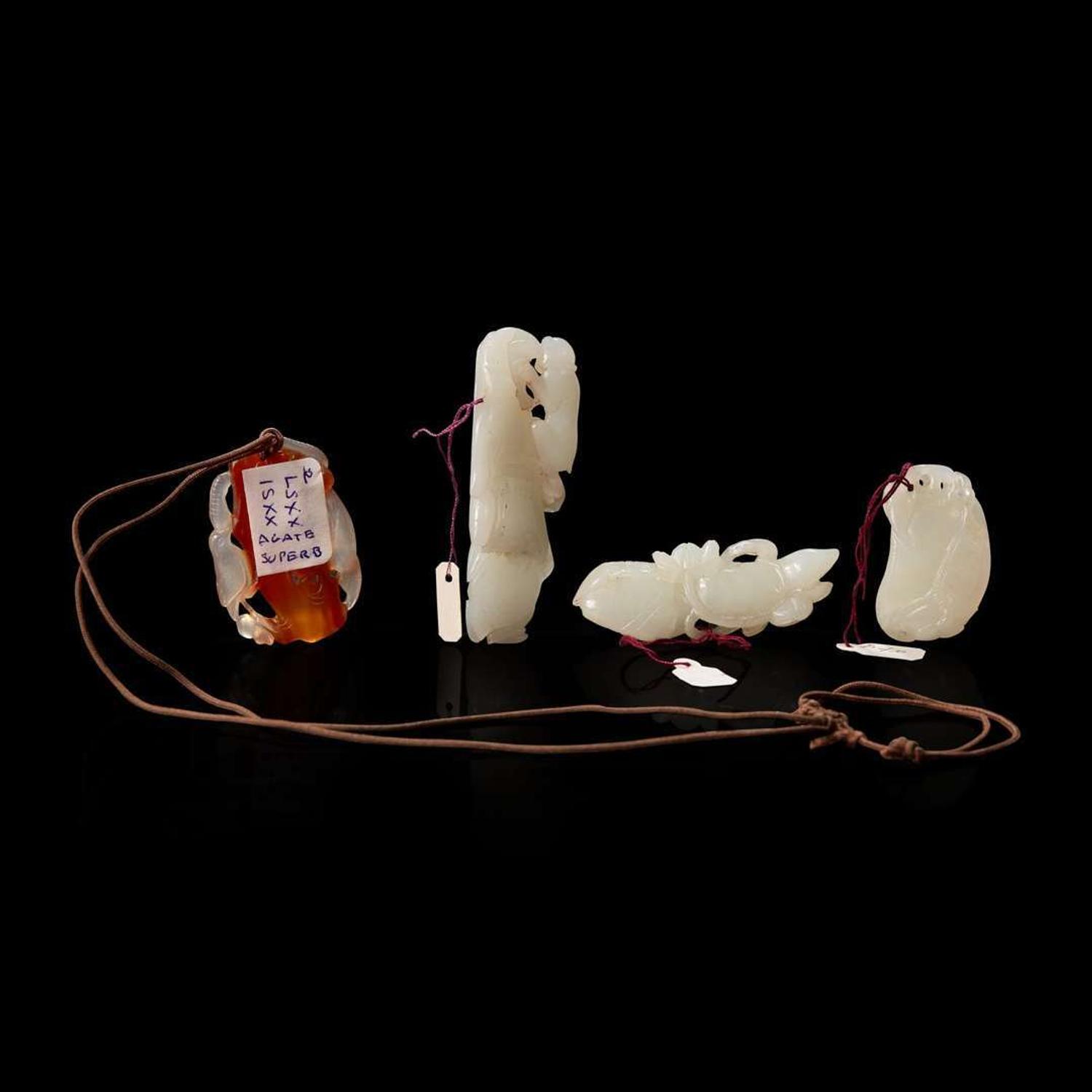 A group of three Chinese white jade carvings and a carnelian pendant