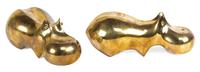 A Pair of Brass Hippos Length 11 1/2 inches.