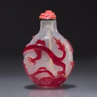 A Chinese Ruby Overlay Glass "Dragon" Snuff Bottle, Qing Dynasty, 18th Century — 清中期 雪霏地套寶石紅料龍戲珠鼻煙壺