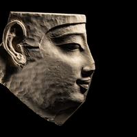 An Egyptian Limestone Sculptor's Model Fragment