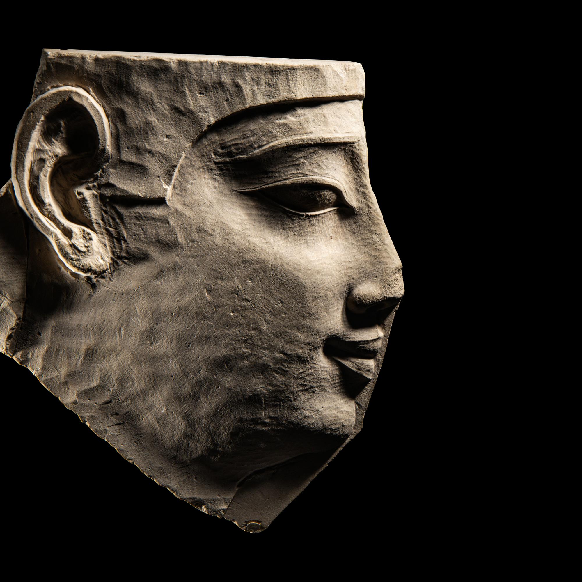 An Egyptian Limestone Sculptor's Model Fragment