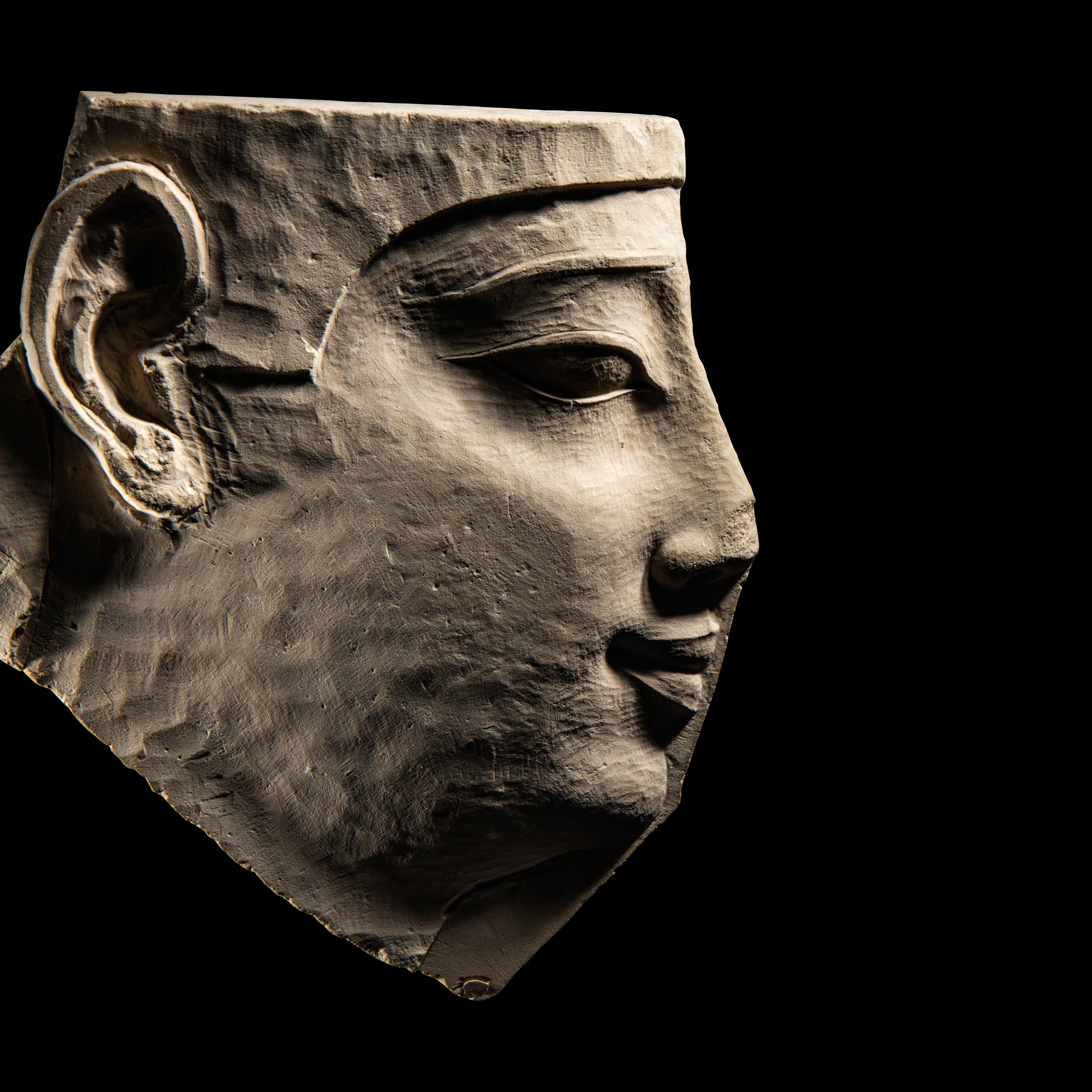 An Egyptian Limestone Sculptor's Model Fragment
