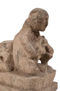 An Asian Carved Stone Seated Figure