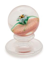 A Charles Kaziun Jr. White Spider Lily on Orange Ground Miniature Tilted Pedestal Glass Paperweight