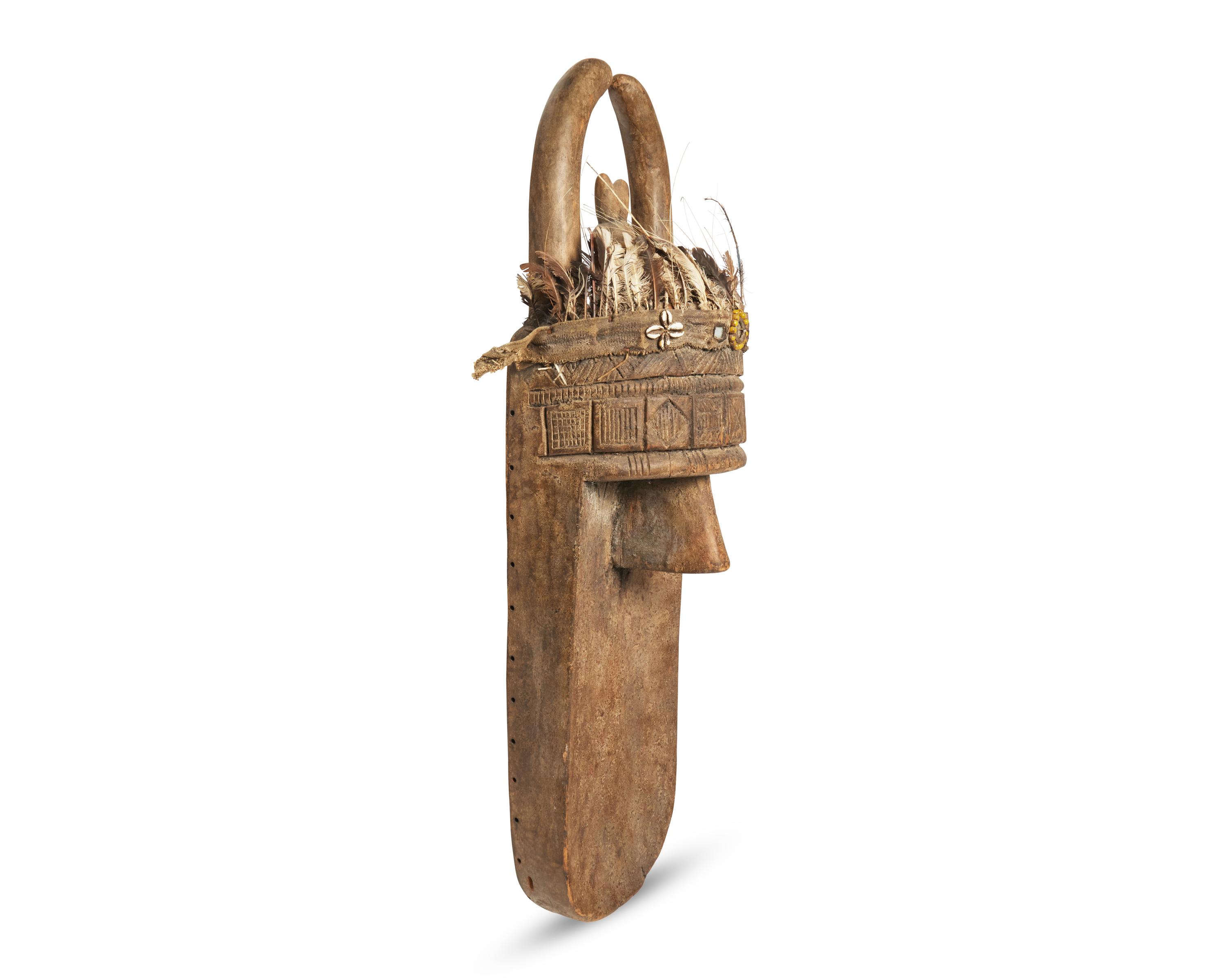 Primitive Mask with Feather and Fetishes