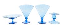 Steuben, 20TH CENTURY, a group of four celeste blue glass table articles