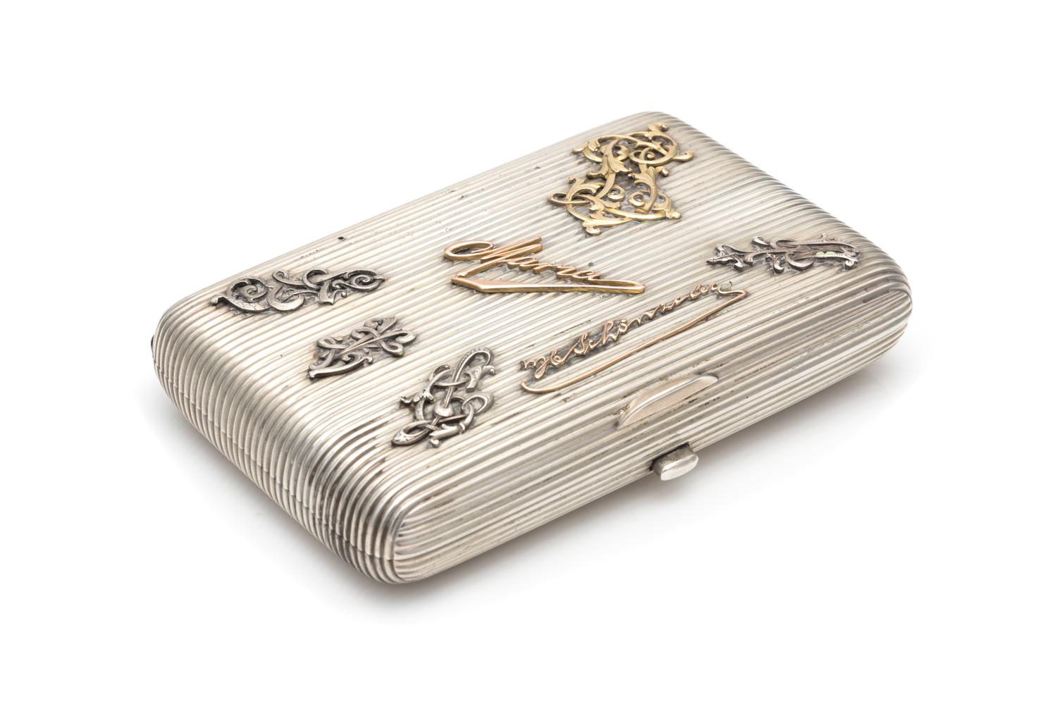 A Russian Silver Cigarette Case, Maker's Mark JN, Assay of Aleksandr Romanov, Warsaw, Late 19th/Early 20th Century, the ribbed case wit