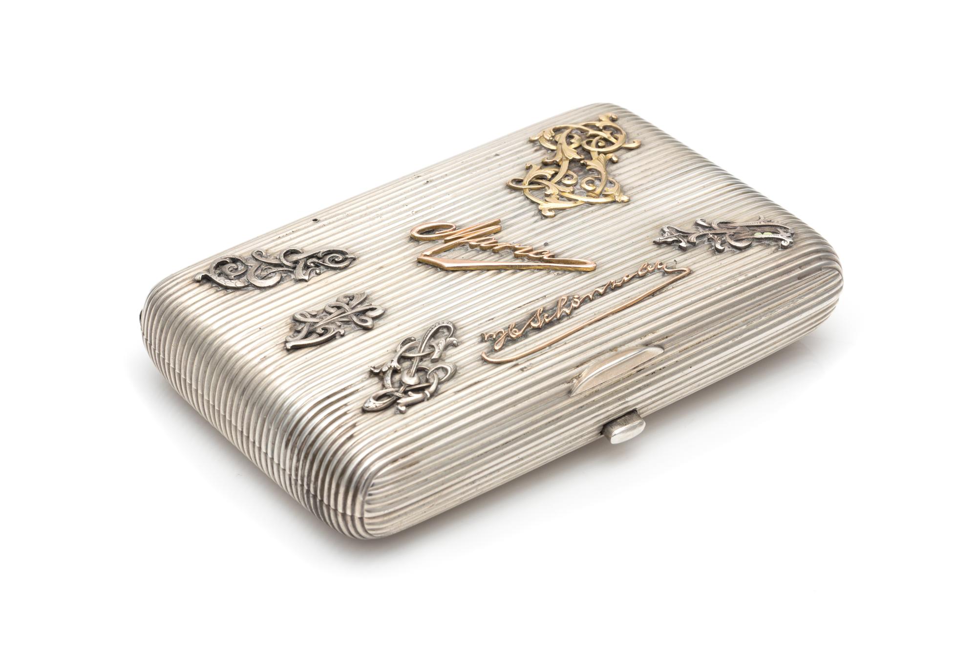 A Russian Silver Cigarette Case, Maker's Mark JN, Assay of Aleksandr Romanov, Warsaw, Late 19th/Early 20th Century, the ribbed case wit