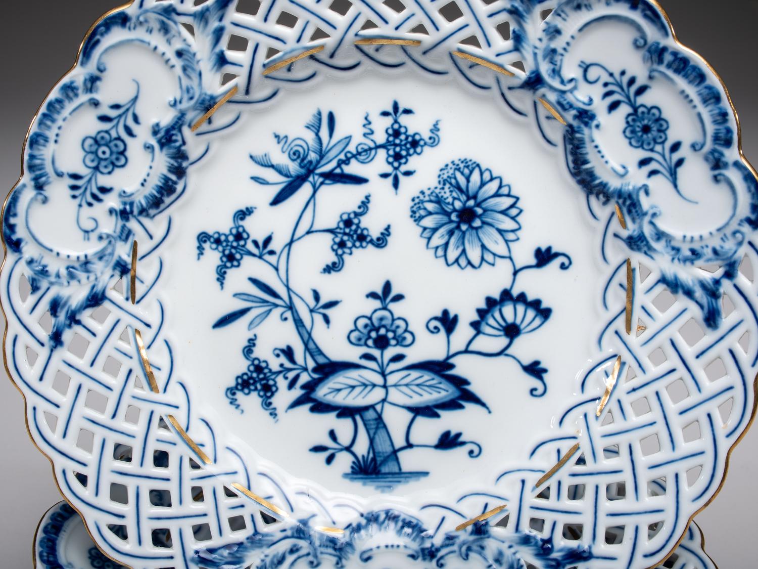 Fourteen Meissen ' Blue Onion' Reticulated Porcelain Plates