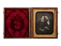 [EARLY PHOTOGRAPHY]. Sixth plate daguerreotype of an affectionately posed couple.