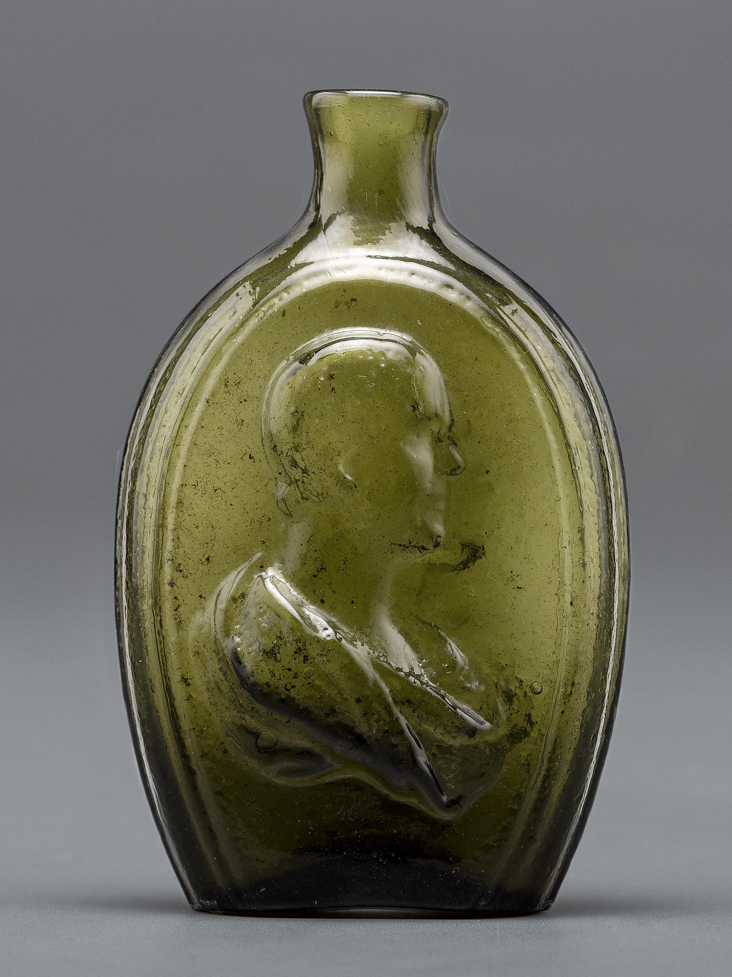 An Olive Green Glass Portrait Bust Flask