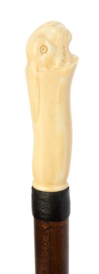 An American Walrus Ivory Handled Walking Stick, Length of handle 3 3/4 x length overall 36 3/4 inches.
