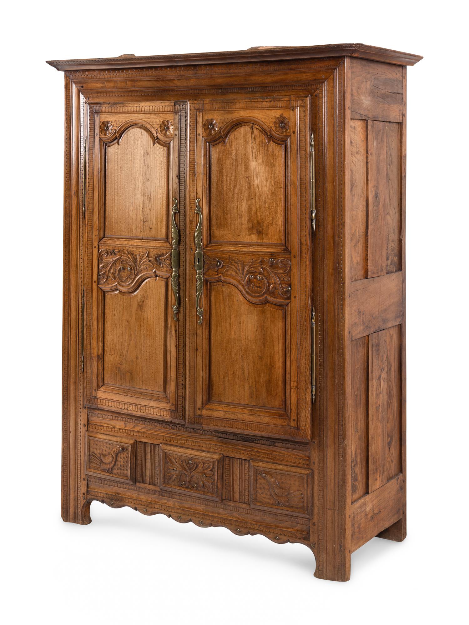 A French Carved Walnut Armoire