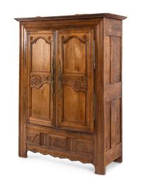 A French Carved Walnut Armoire