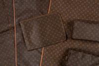 A Collection of Six Louis Vuitton Travel Accessories