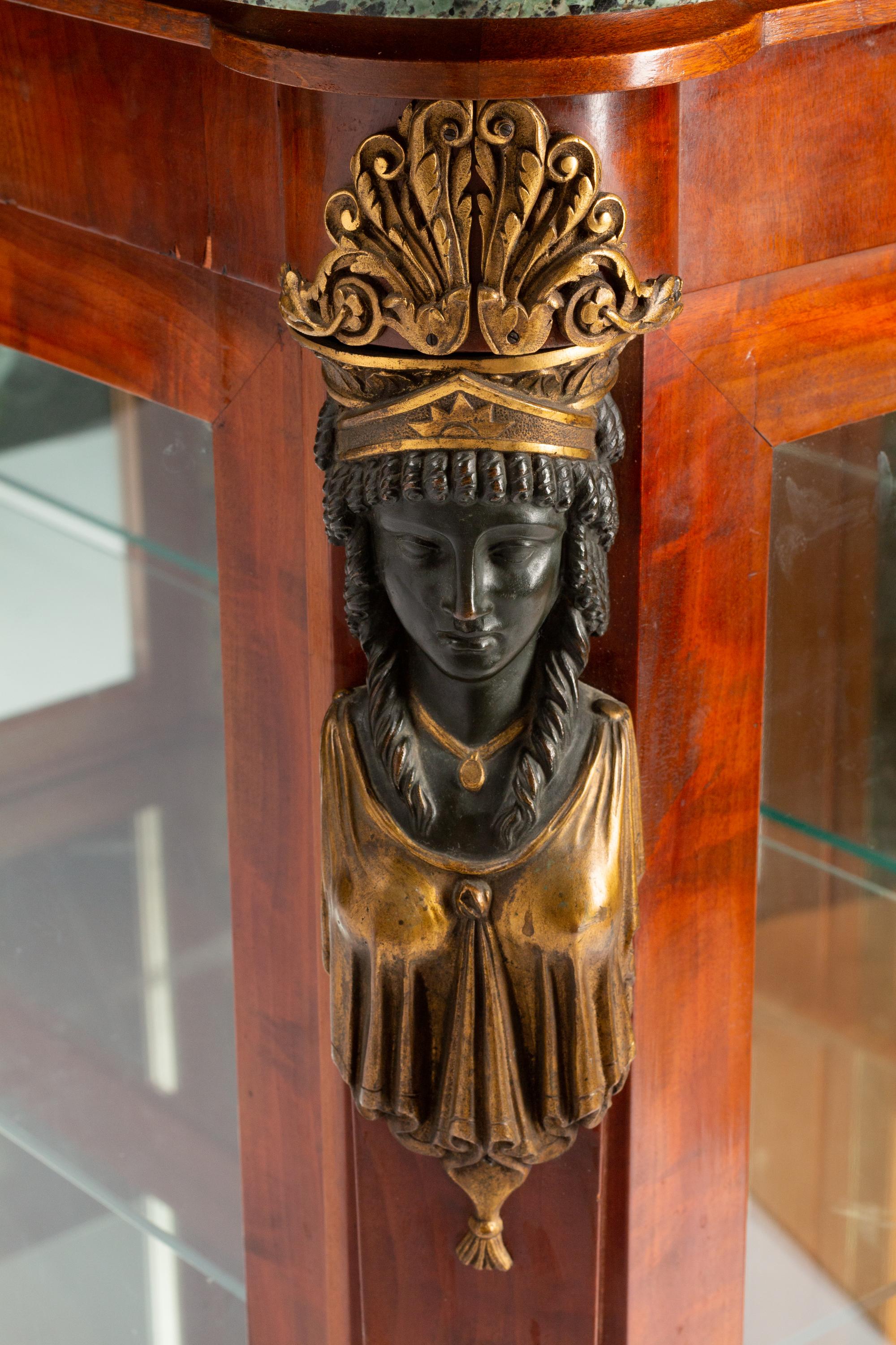 An Empire Egyptian Revival Style Gilt and Patinated Bronze Mounted Mahogany Cabinet