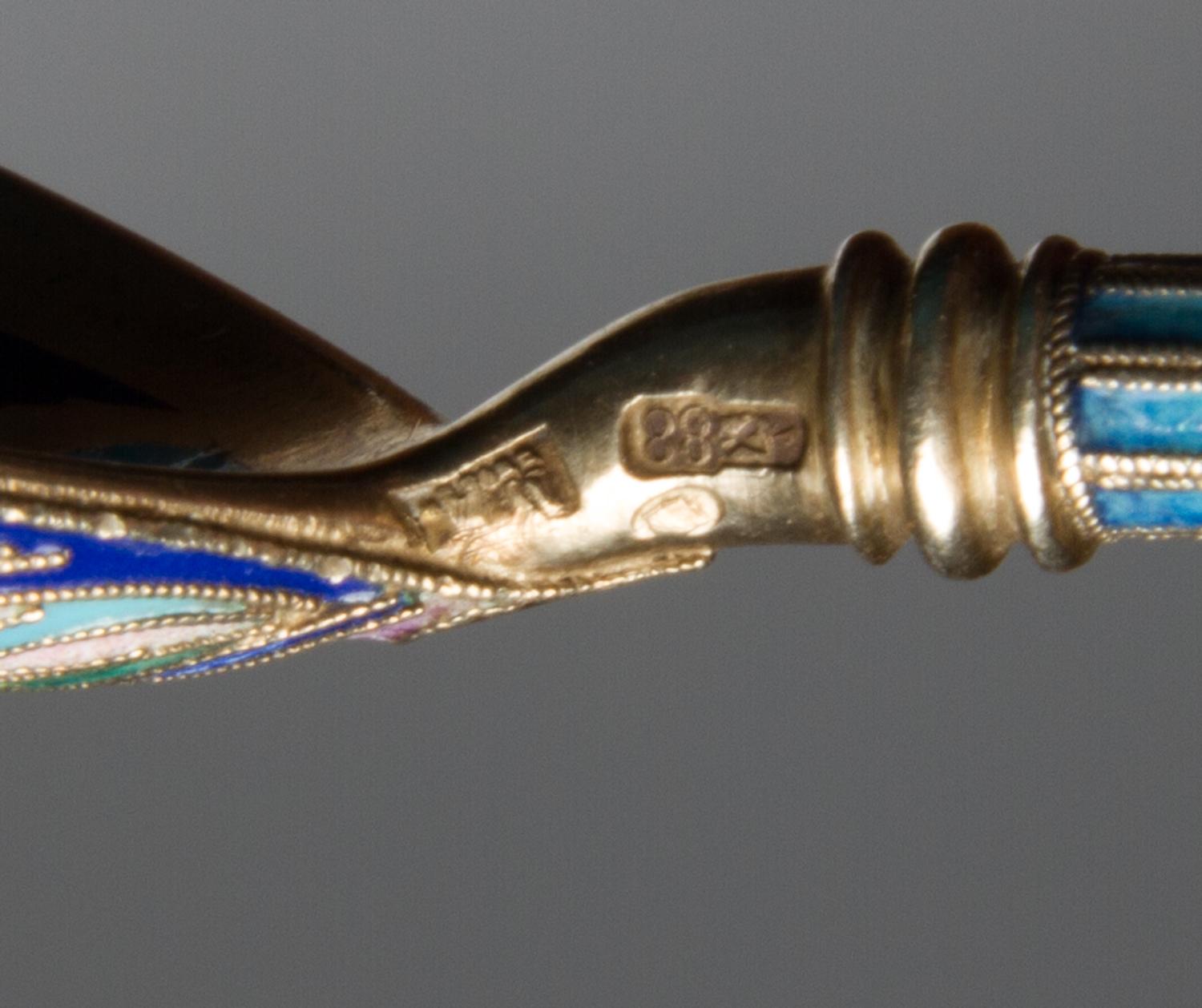 Two Russian Silver-Gilt and Enamel Spoons, Maker's marks obscured, Moscow, early 20th century, each having a polychrome enamel handle a