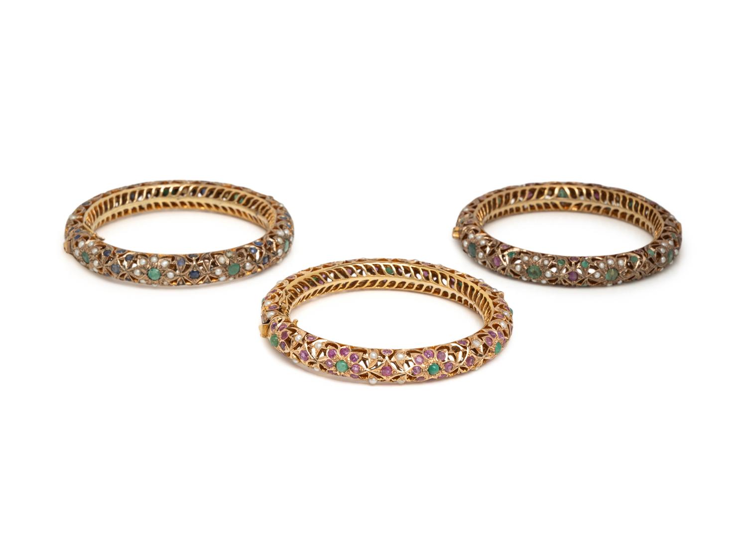 COLLECTION OF YELLOW GOLD AND LOW KARAT GOLD MULTIGEM BANGLE BRACELETS