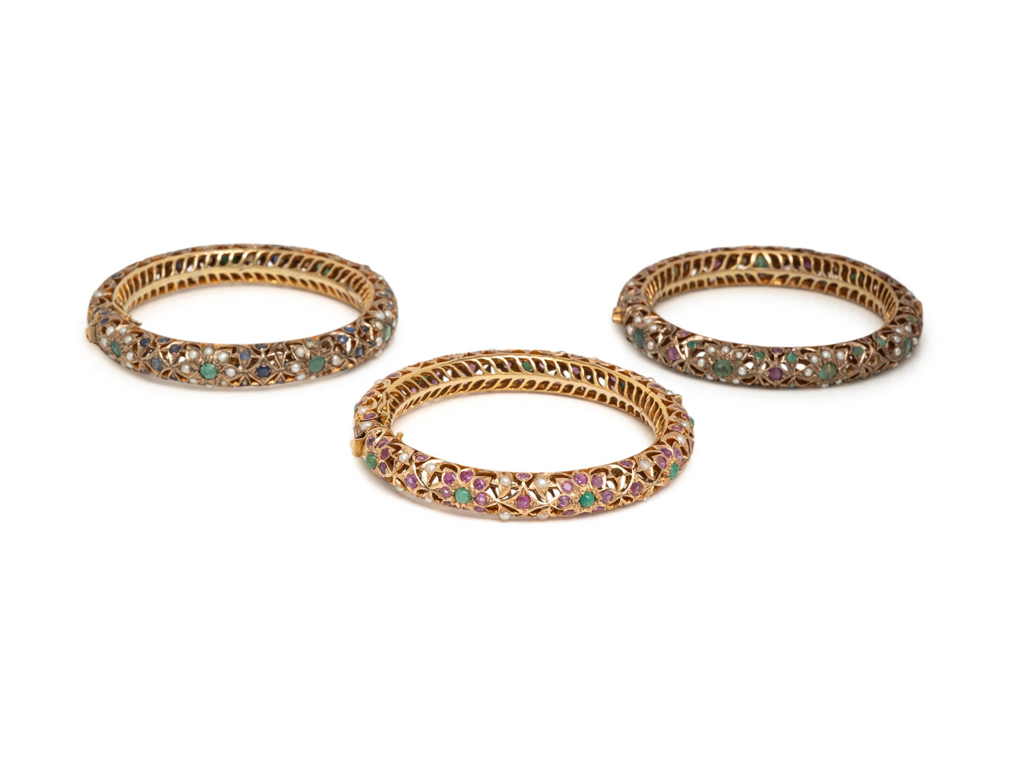 COLLECTION OF YELLOW GOLD AND LOW KARAT GOLD MULTIGEM BANGLE BRACELETS