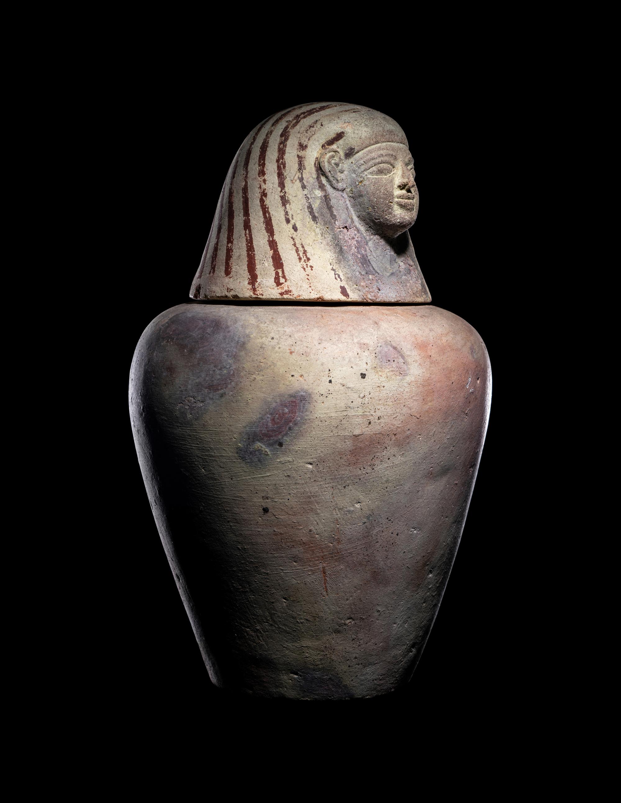 An Egyptian Painted Pottery Canopic Jar